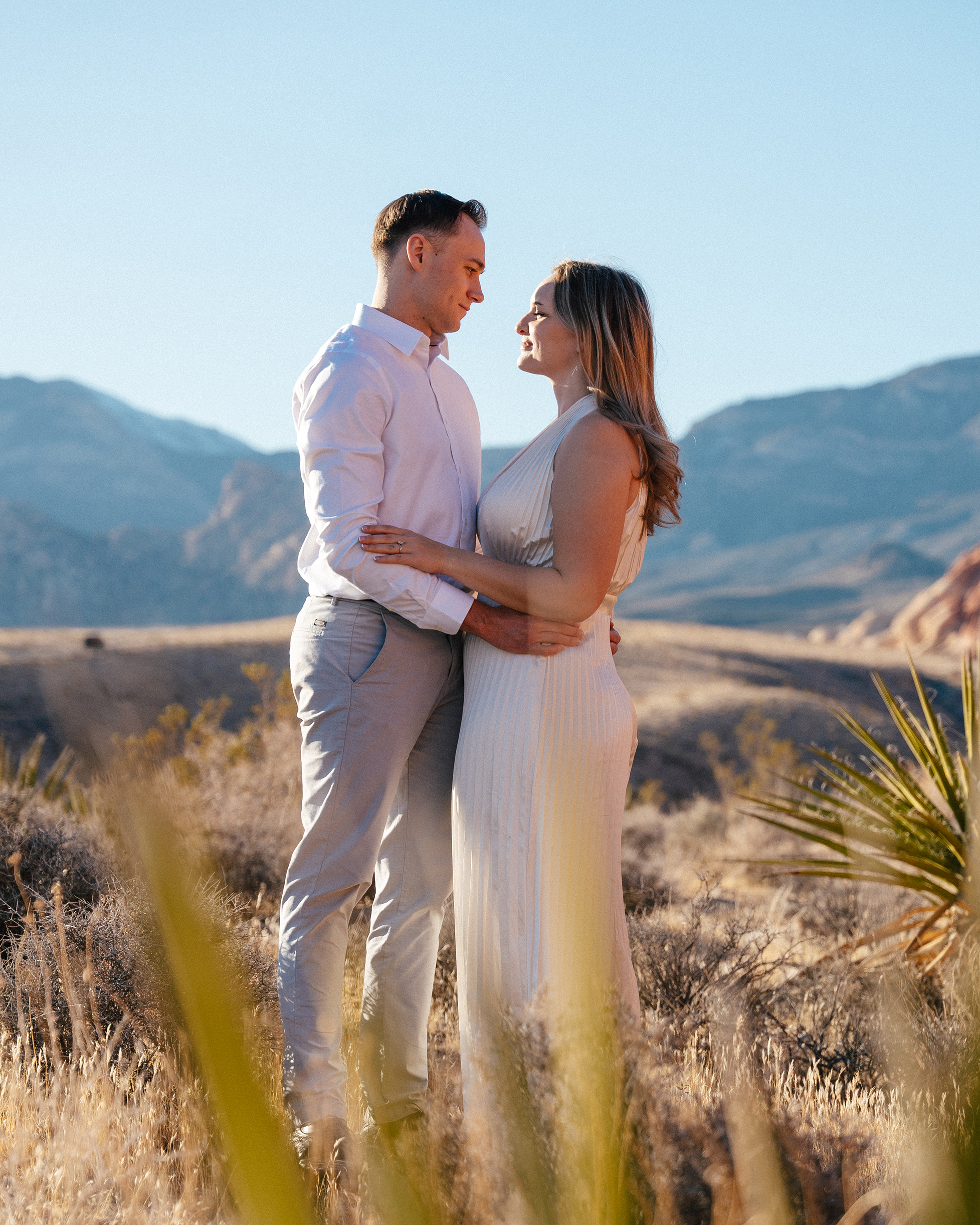 couple shares an intimate moment just outside at Red Rock Canyon, NV