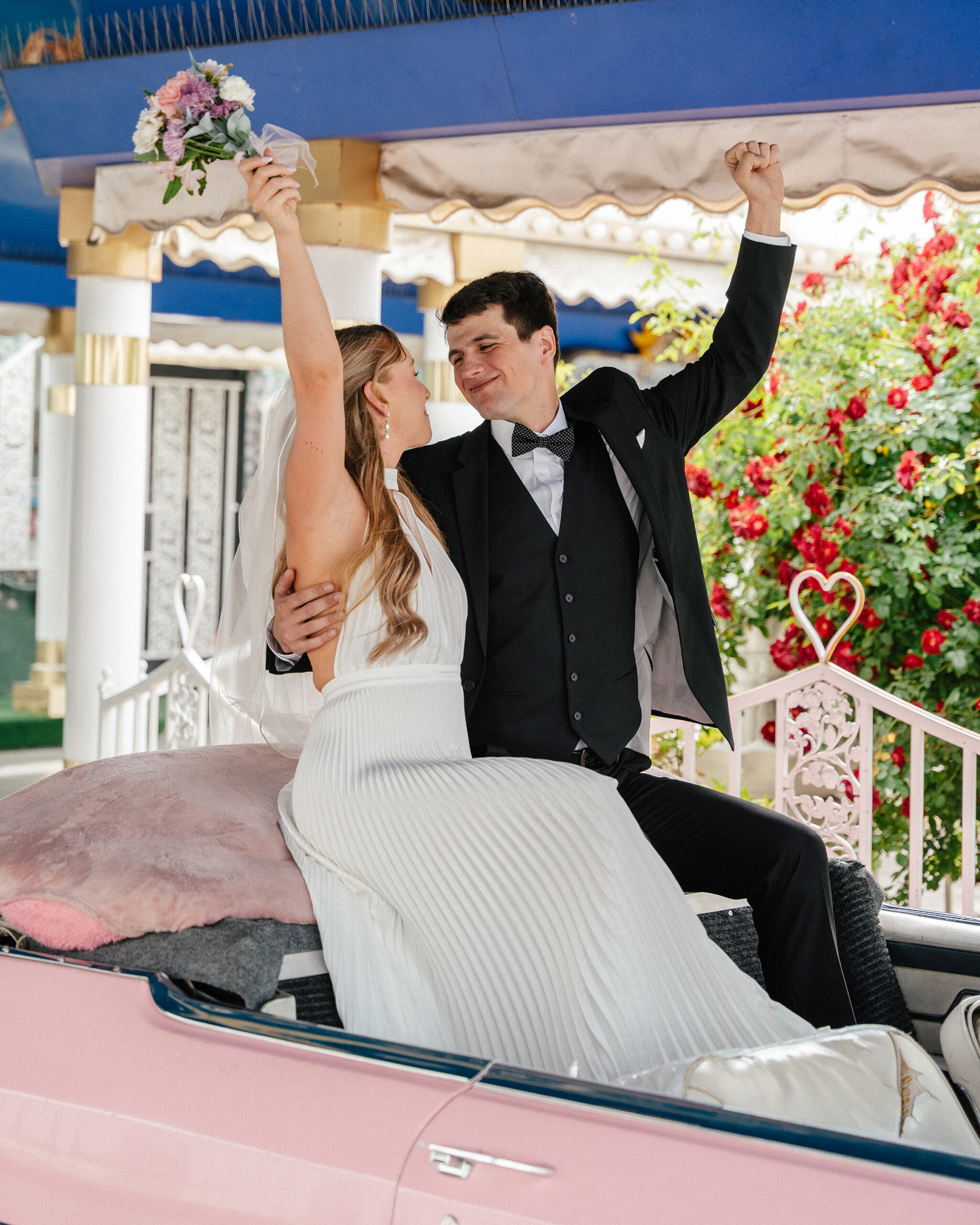 Couple getting married in their car inside the Tunnel of Love at A Little White Wedding Chapel.