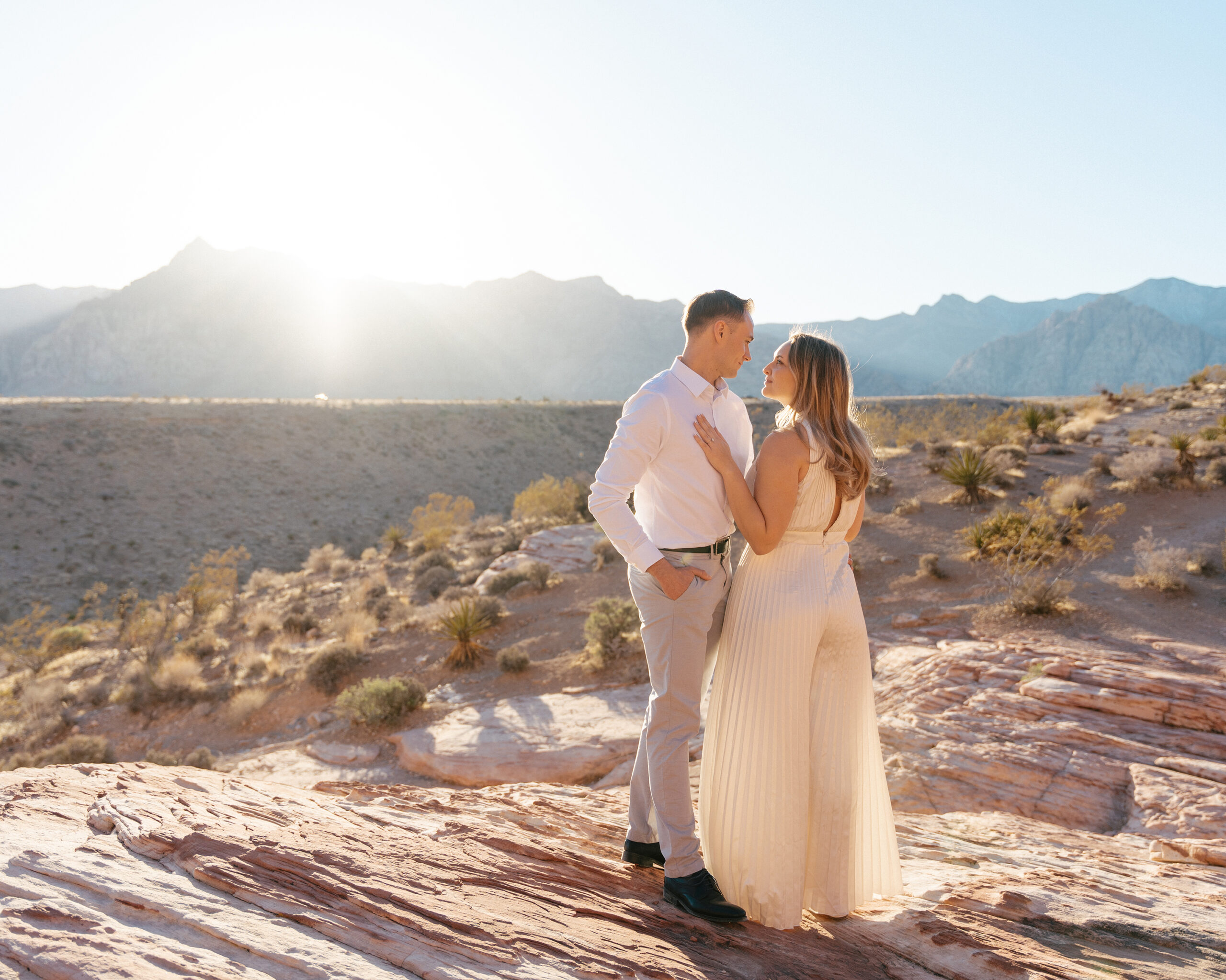 couple shares an intimate moment at sunset in red rock canyon just outside of las vegas, nv
