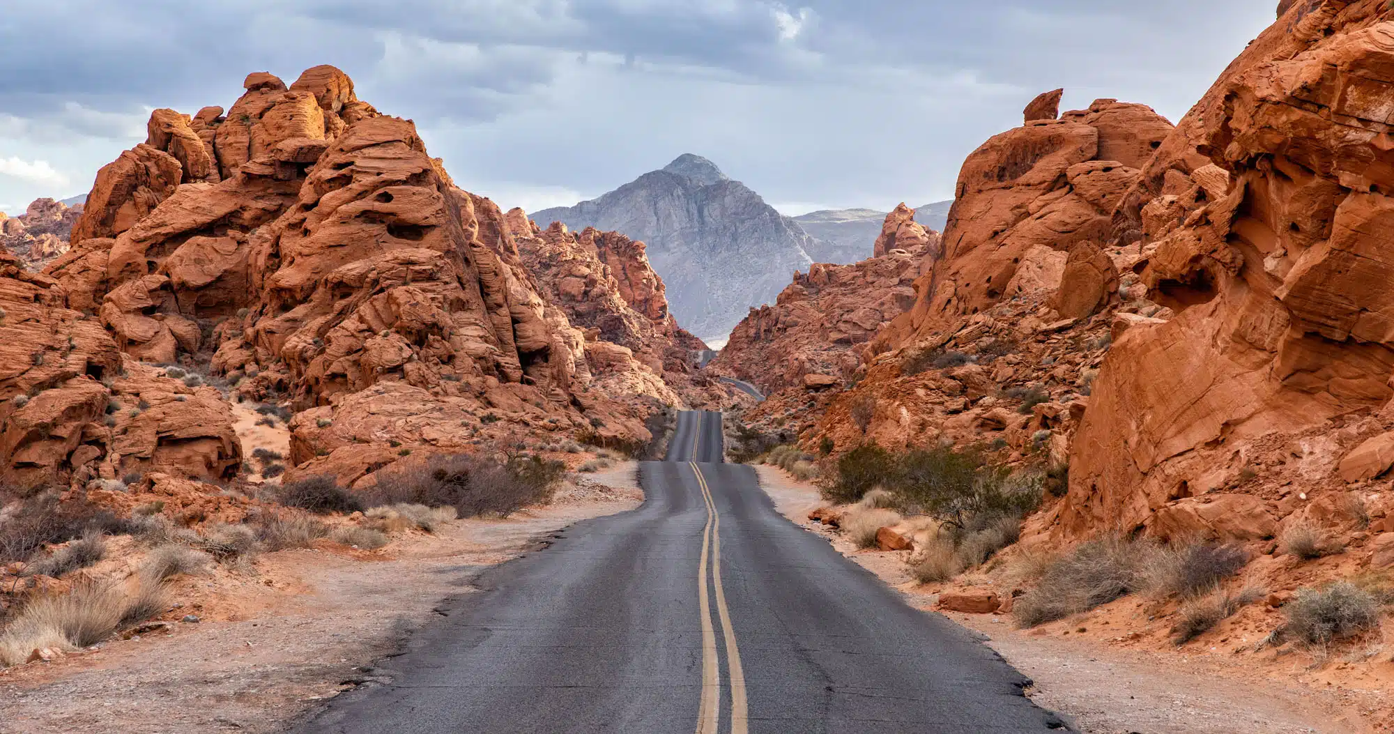 the iconic view of the road winding through the mountains in valley of fire state oark, just outside of las vegas, nv