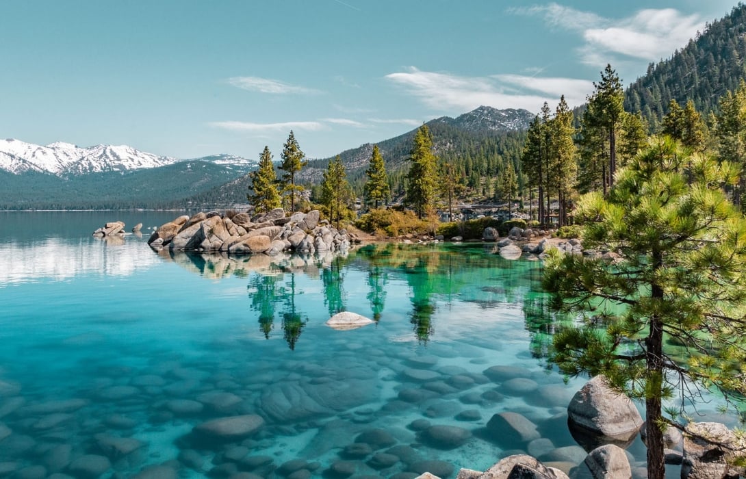 Turquoise waters, granite boulders, and pine trees shine at Sand Harbor in Lake Tahoe—one of the most stunning elopement and engagement photo spots in Nevada.