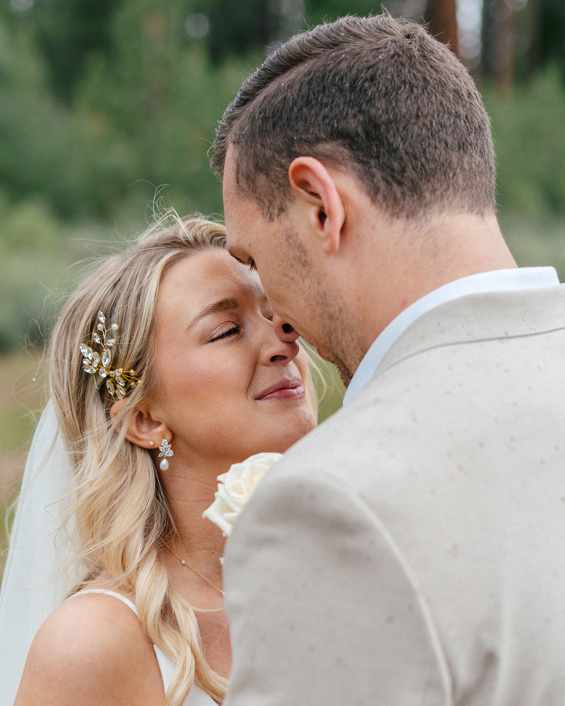 A close-up of the bride and groom during their South Lake Tahoe wedding at The Arch, sharing a tearful, joyful moment.
