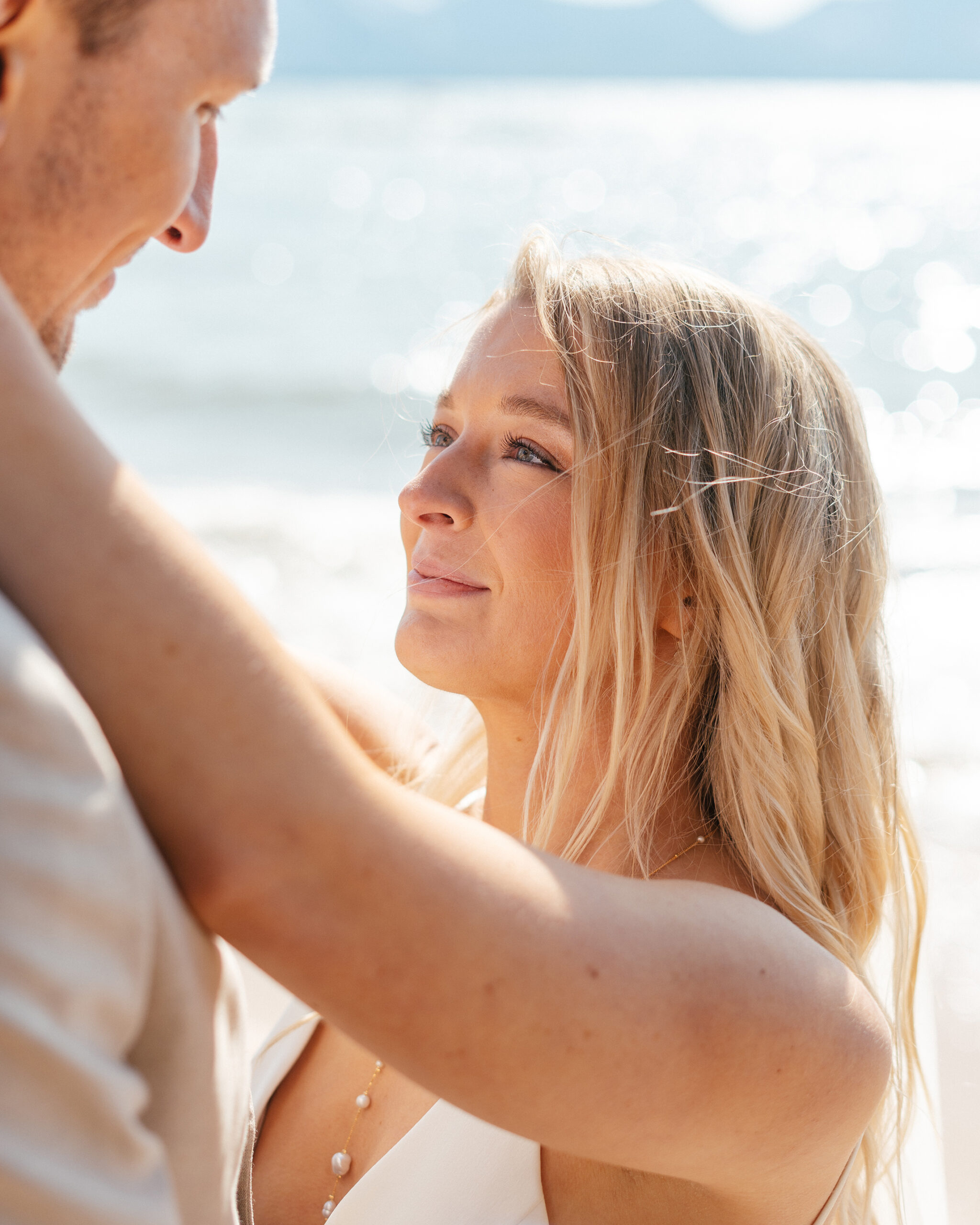 A close-up of the bride and groom during their South Lake Tahoe wedding at The Arch, sharing a tearful, joyful moment.