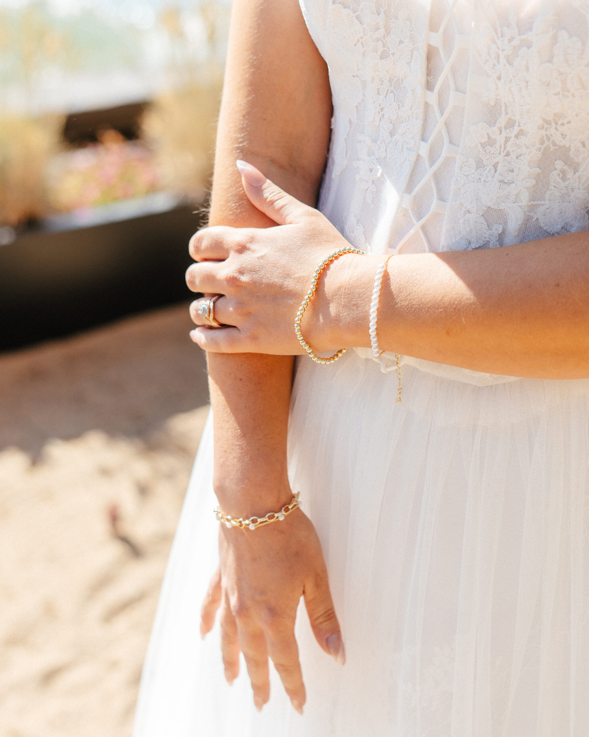 A close-up look at the bride’s rings and bracelets during her South Lake Tahoe beach wedding.