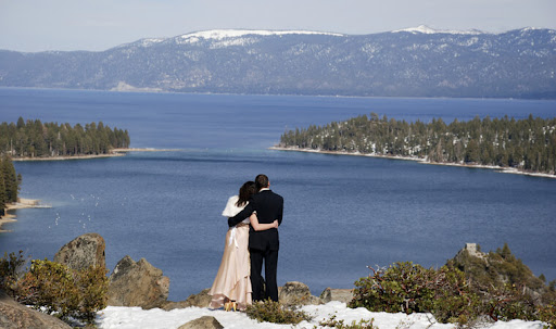 newlyweds enjoy a view of emerald bay in lake Tahoe, CA